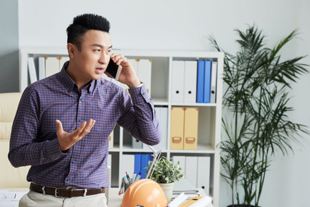 Consulting client on the phoneの写真素材