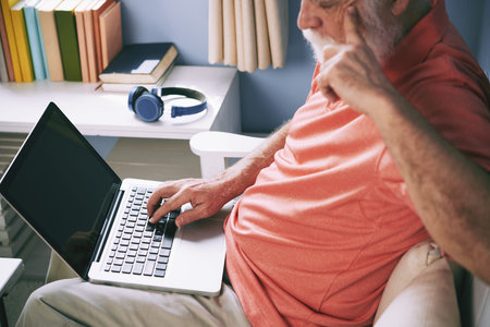 Elderly man surfing the net
