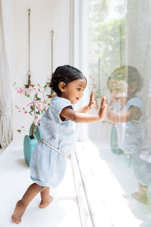 Girl on window sillの写真素材