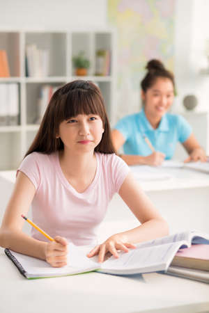 Teenage Pupil Studying in Classroomの写真素材