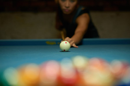 Pool player breaking up balls, selective focusの写真素材