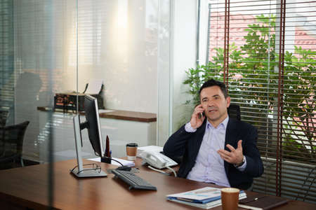 Businessman talking on phoneの写真素材