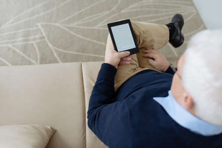Enjoying interesting bookの写真素材