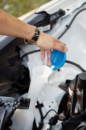 Driver wants to add windshild washer fluidの写真素材