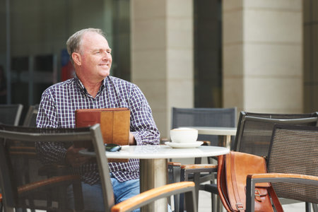 Man in outfoor cafe