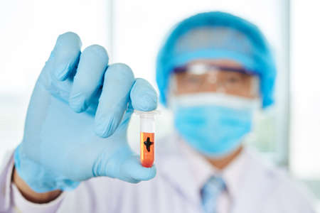 Unrecognizable Researcher with Test Tubeの写真素材