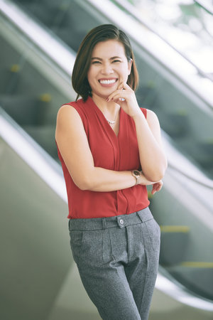 Portrait of cheerful excited young female entrepreneur