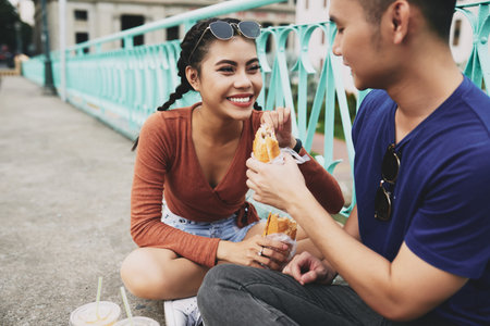 Couple enjoying sandwiches