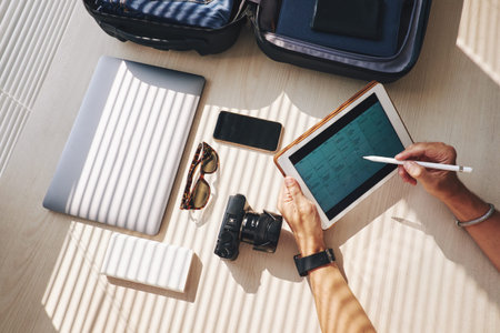 Close-up of businessman planning his work in touchpad