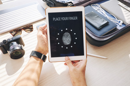 Close-up of man making password on his touchpadの写真素材