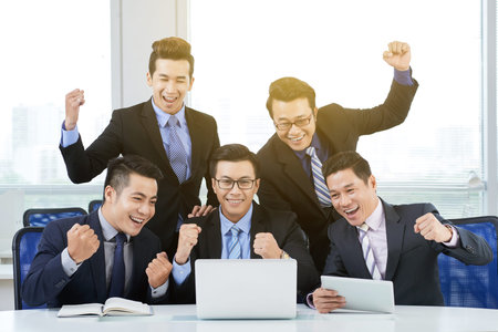 Asian Employees Celebrating Success