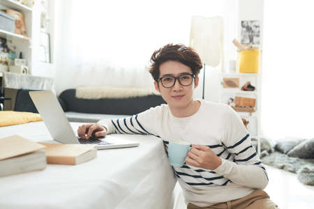 Student in his roomの写真素材