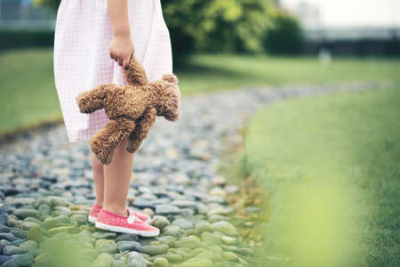 Small girl with teddy bearの写真素材