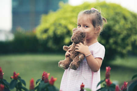 Girl with teddy bearの写真素材