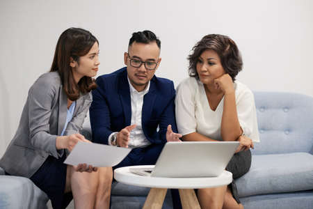 Discussing financial indicatorsの写真素材