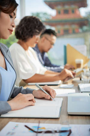 Woman writing business planの写真素材
