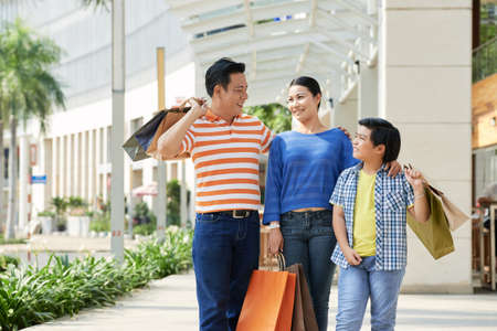 Asian Family with Shopping Bagsの写真素材