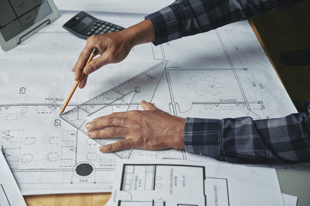 Close-up image of businessman working on construction plan