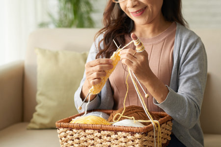 Mature woman spending time at home for knitting