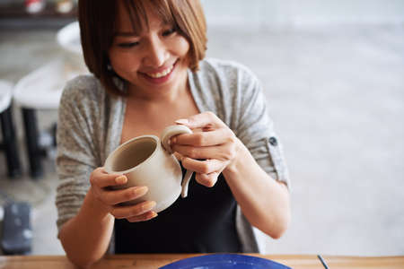 Making clay mugの写真素材