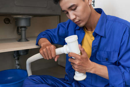 Plumber assembling pipeの写真素材