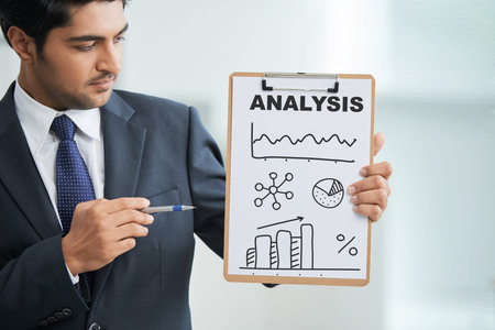 Businessman showing analysis document