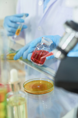 Chemist adding reagent