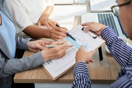 Business executives analysing data