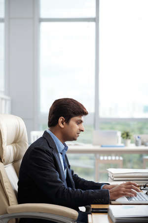 Businessman busy with workの写真素材