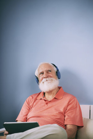 Old man listening to musicの写真素材