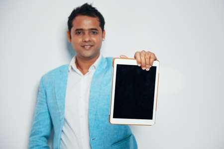 Businesman showing tablet computerの写真素材