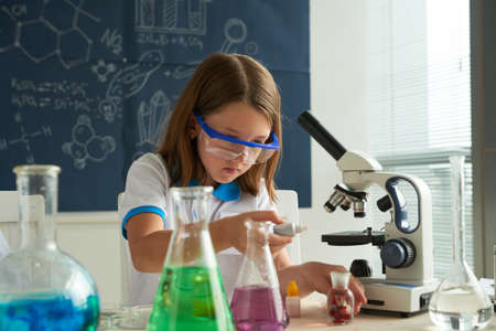 Girl working with reagentsの写真素材