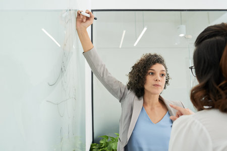Woman drawing business chart