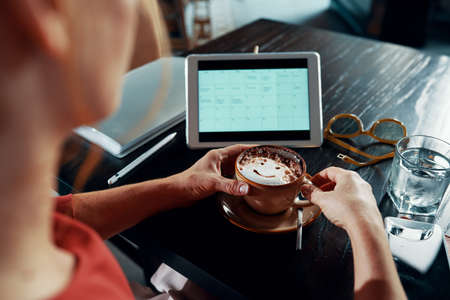 Woman checking calendarの写真素材