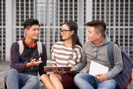 Students discussing projectの写真素材