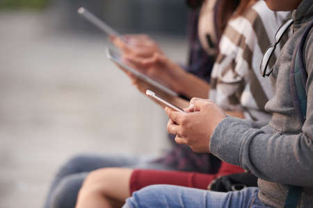 Young people using gadgetsの写真素材