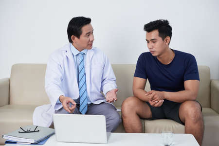 Doctor talking to patientの写真素材
