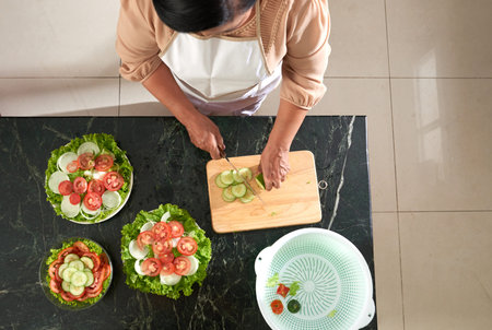 Housewife cooking salad