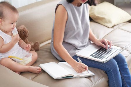 Young mother working from home