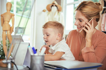 Business lady and her sonの写真素材