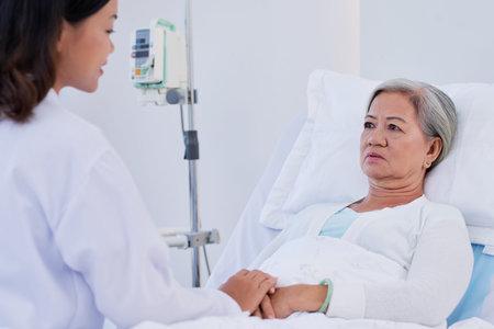 Doctor meets with patient in hospital