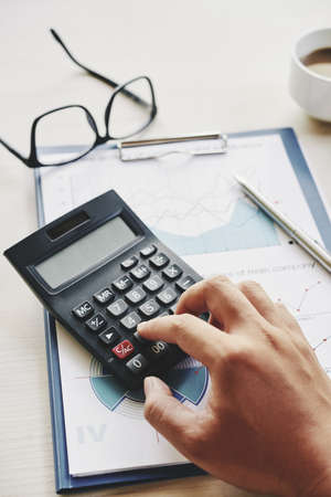 Manager calculating expensesの写真素材