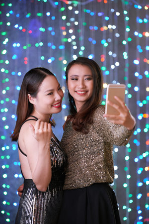 Female friends taking selfie