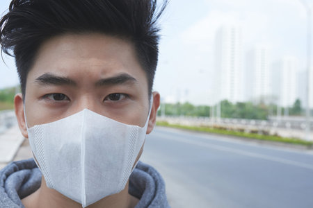 Asian man in protective mask