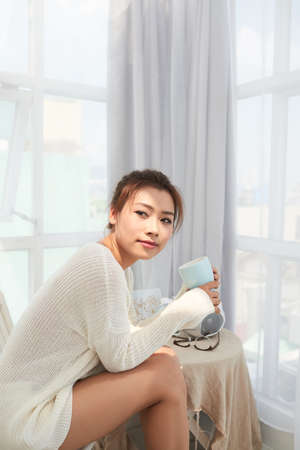 Girl drinking coffeeの写真素材