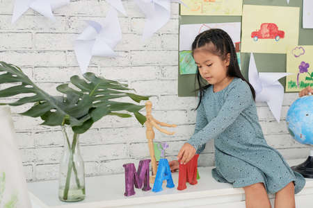 Girl playing in classの写真素材