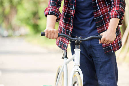 Walking with bicycleの写真素材