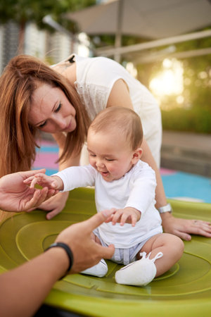 Parents playing with babyの写真素材