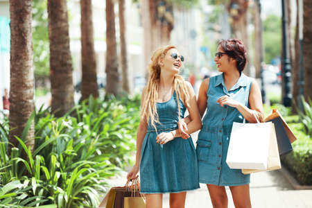 Shopping women  walking togetherの写真素材