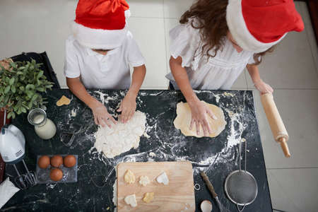 Children baking Christmas cookiesの写真素材
